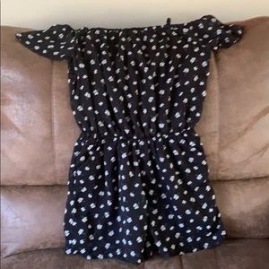 Abercrombie black romper with white flowers.